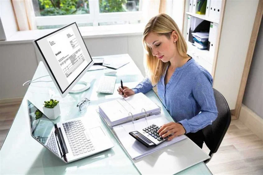 accountant going over paperwork