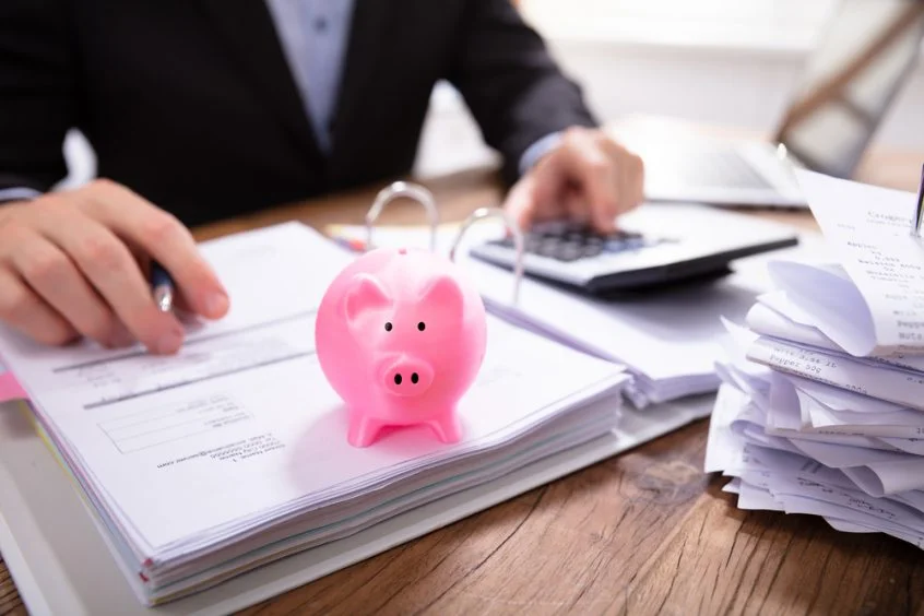 piggy bank and accountant showing you that importance of saving