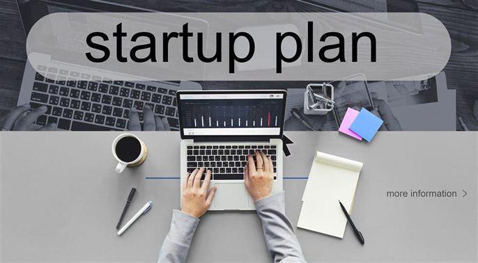 person on their laptop and creating a startup plan for their business